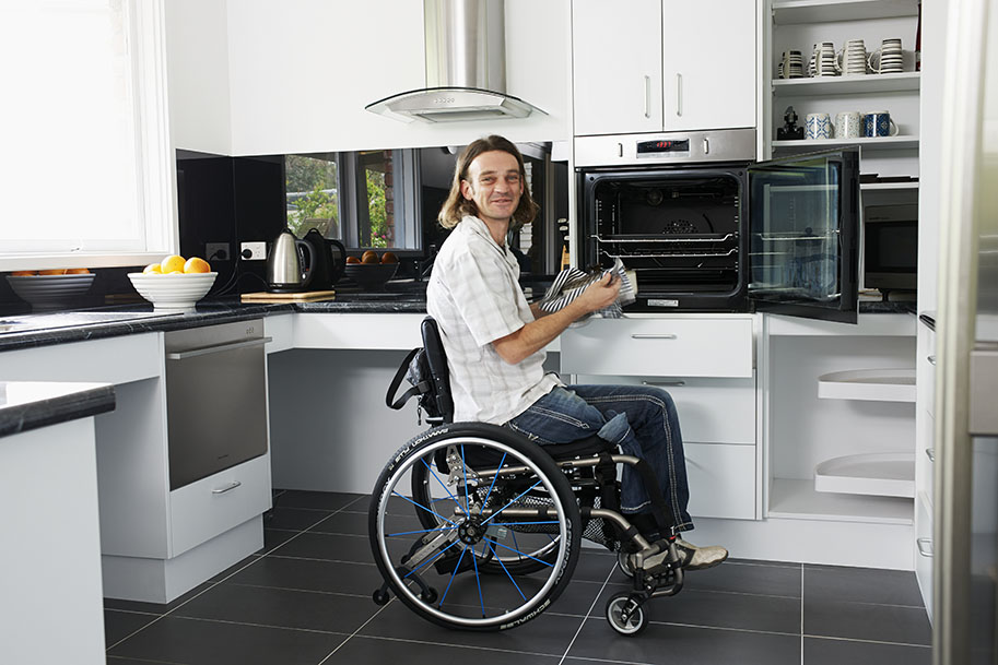 Person using their modified accessible kitchen